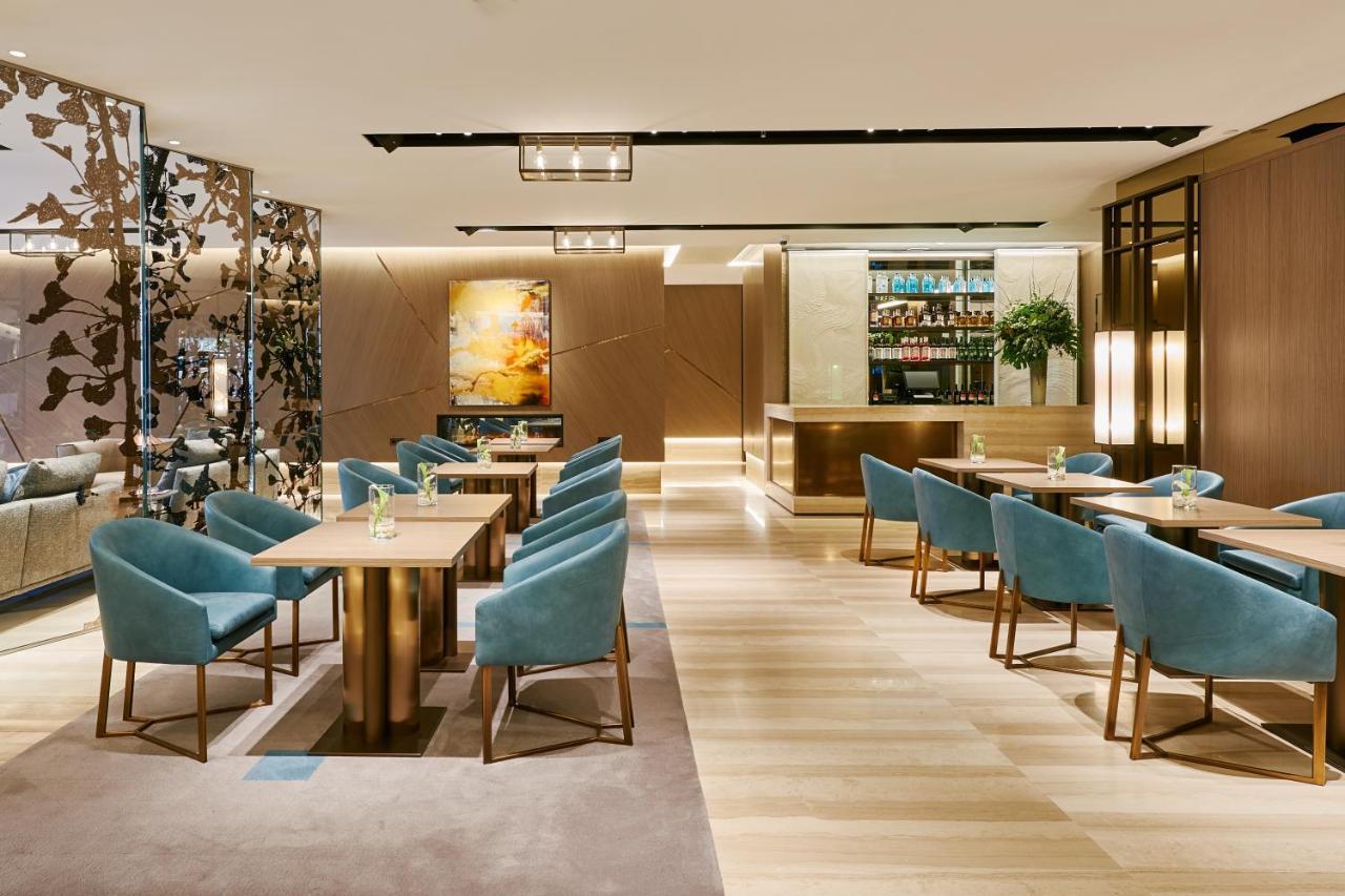 Vp Plaza Espana Design Мадрид Екстериор снимка The Wing at Hong Kong International Airport